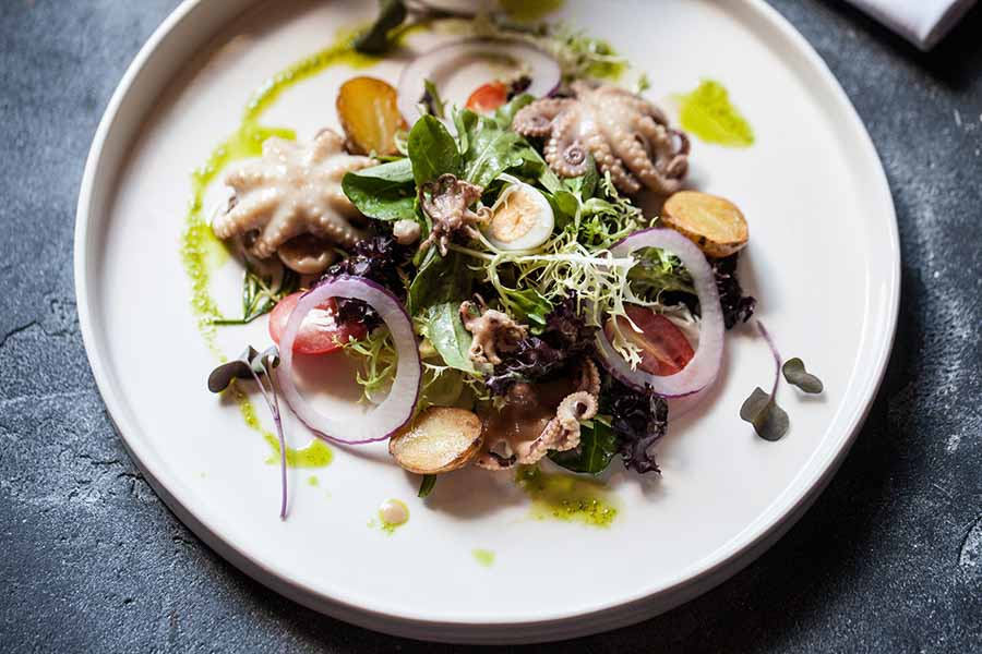`Салат с мини-осьминогами` в ресторан `Волна` - официальное фото